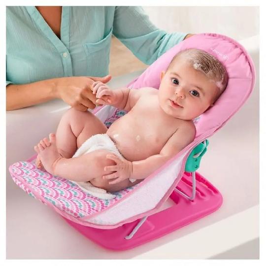 Safely and securely bathe your newborn in comfort with the Summer Deluxe Baby Bather. A soft, mesh newborn sling cradles your ba